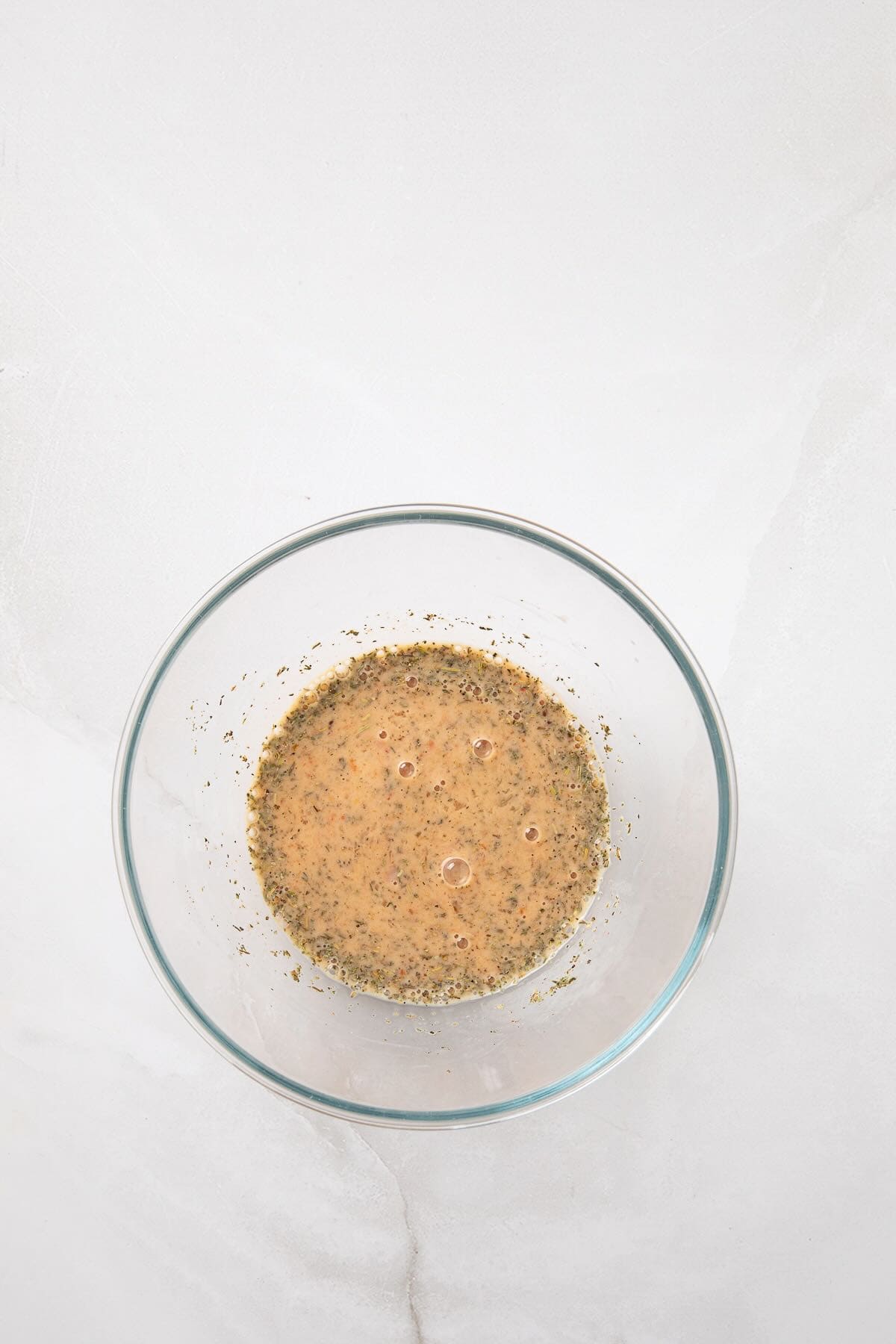 Egg, tomato paste and other ingredients whisked together.