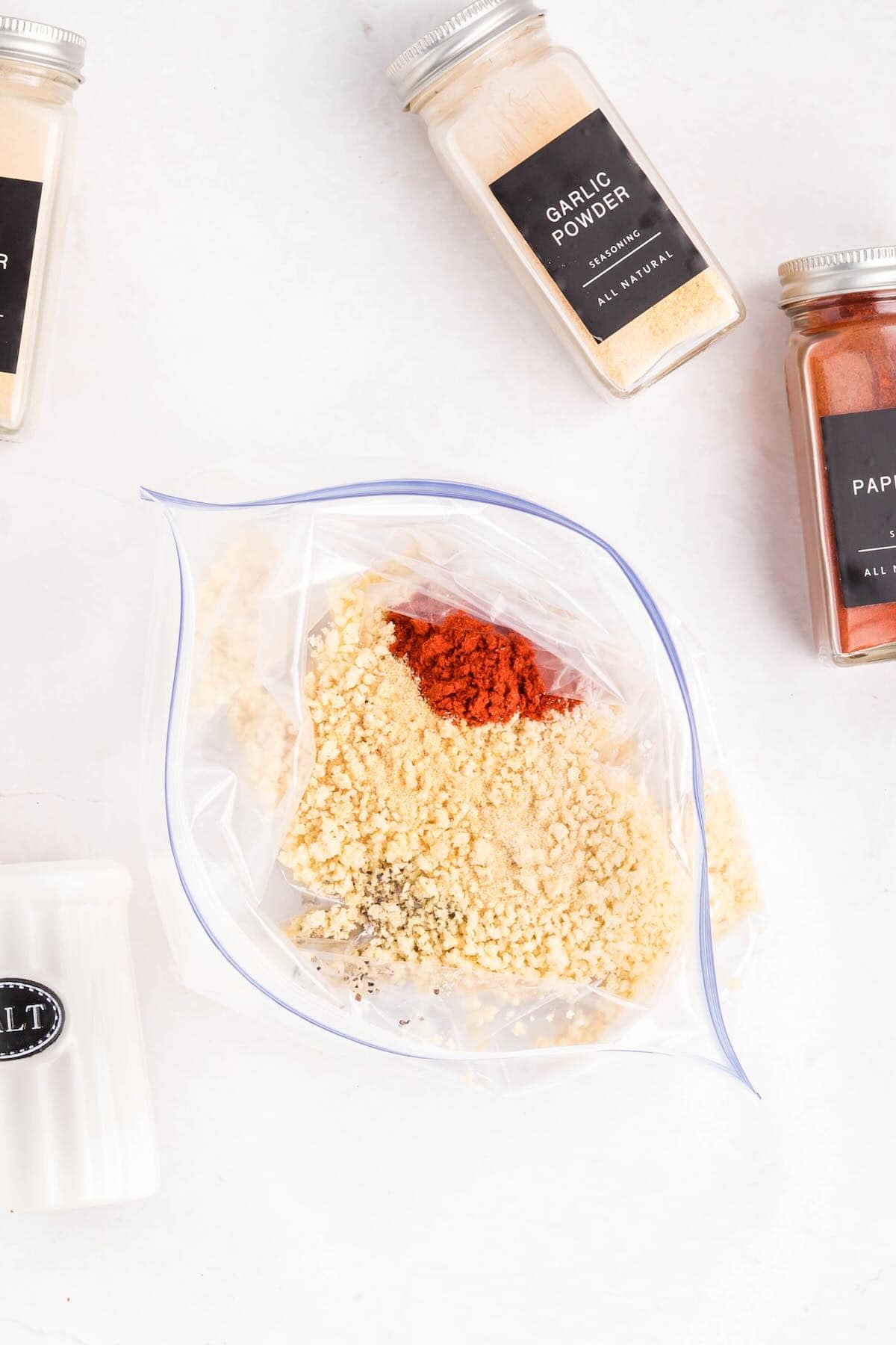 Panko, paprika and other seasonings in a plastic storage bag.