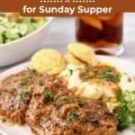 Pinterest pin with a serving of country-style steak smothered in onion gravy with mashed potatoes and mini cornbread muffins.