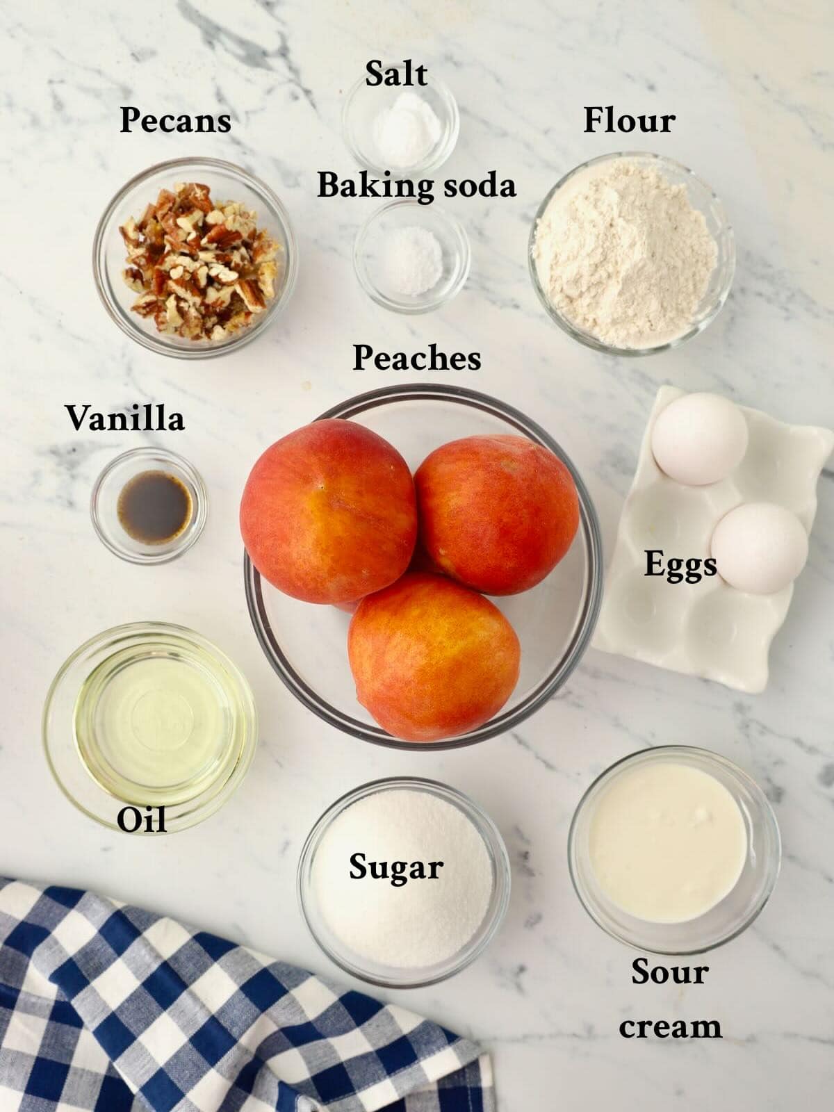 Ingredients for peach bread include fresh peaches, eggs, flour, sugar, oil, sour cream, and pecans