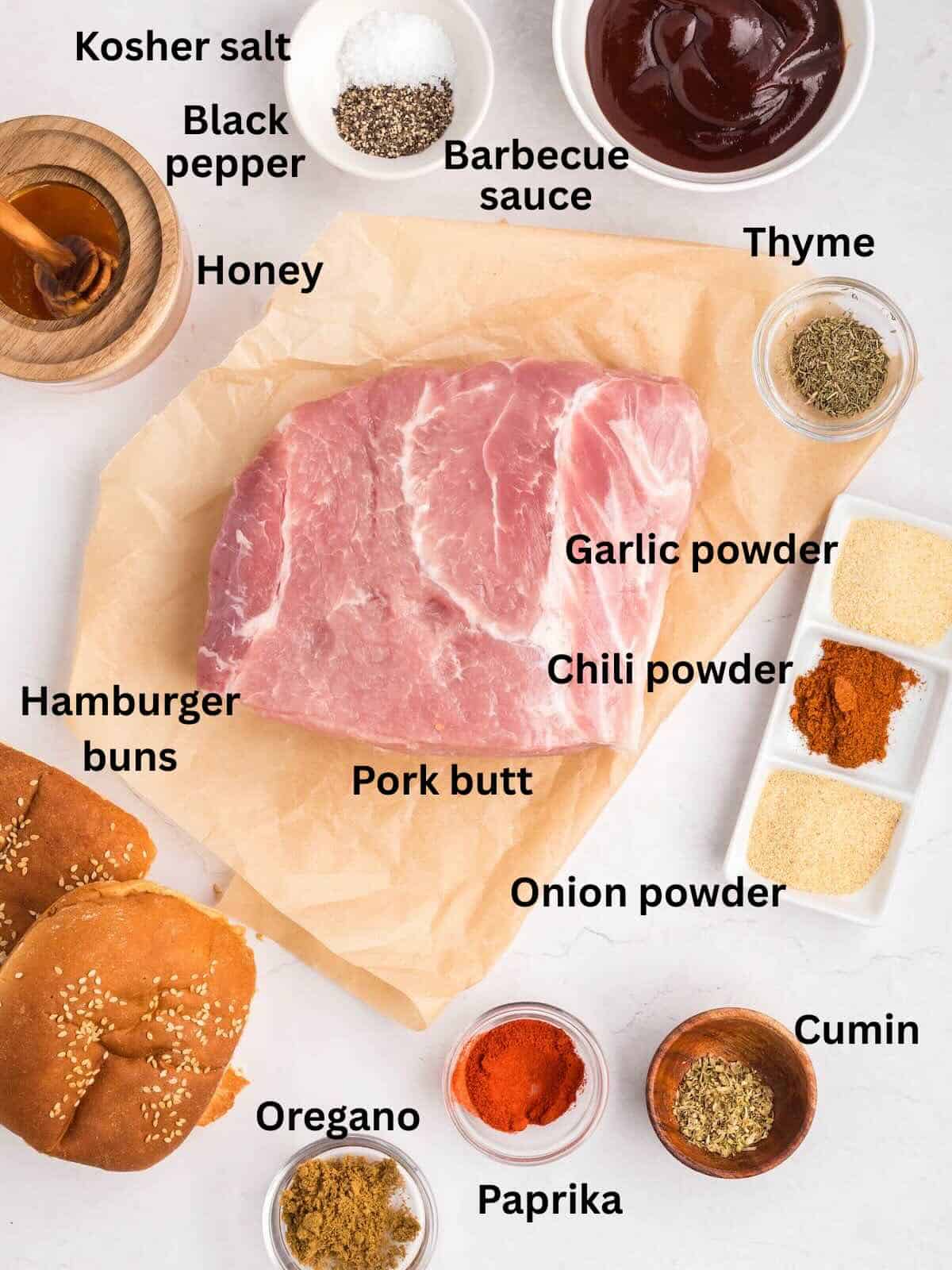 Ingredients to make air-fryer pulled pork, include a boston butt pork roast, barbecue sauce, and seasonings.