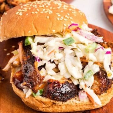 Air fryer pulled pork with crispy edges served on a bun with coleslaw