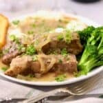 Slow cooker country style ribs with Vidalia onion gravy served over creamy mashed potatoes