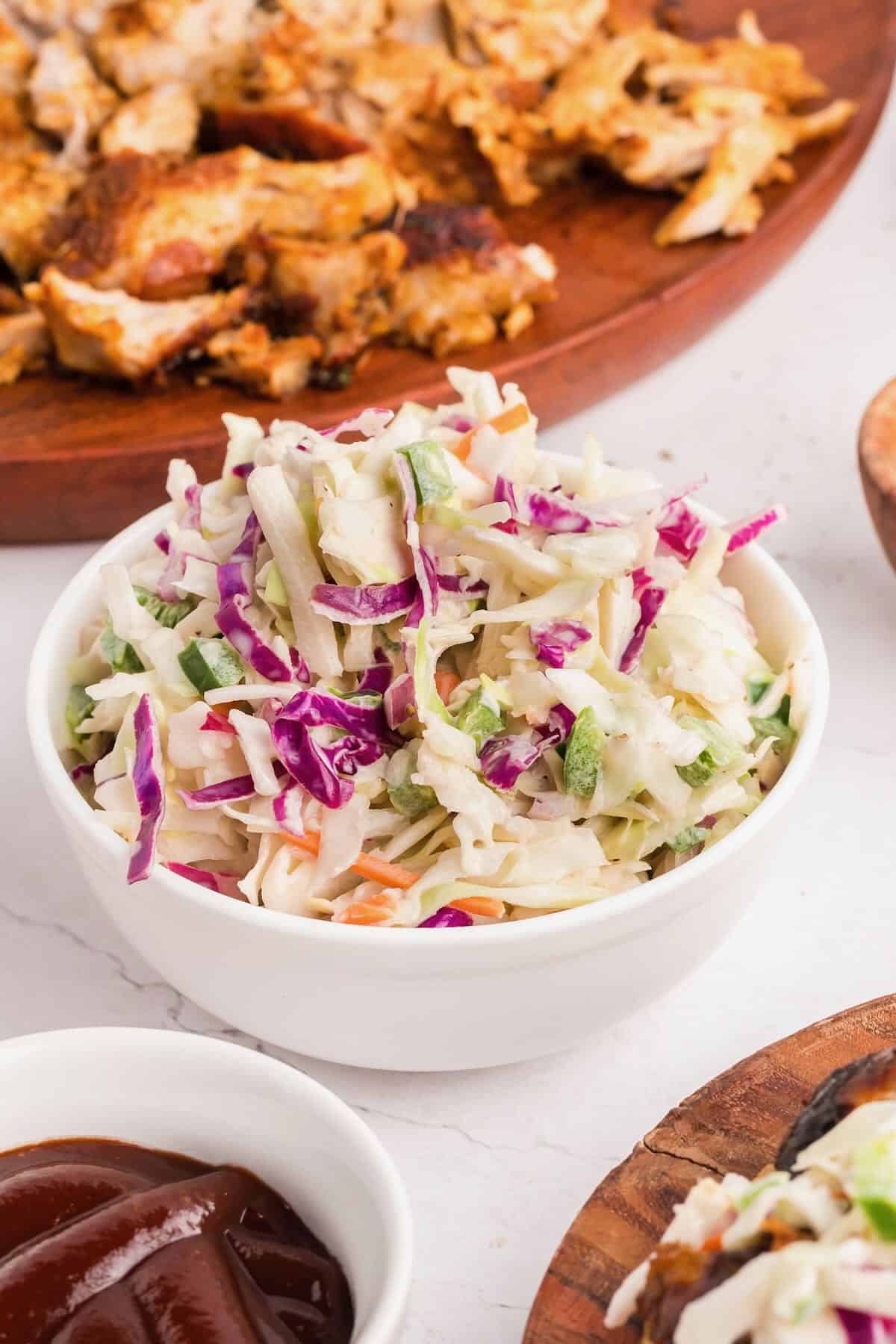 Spicy coleslaw in a white bowl.