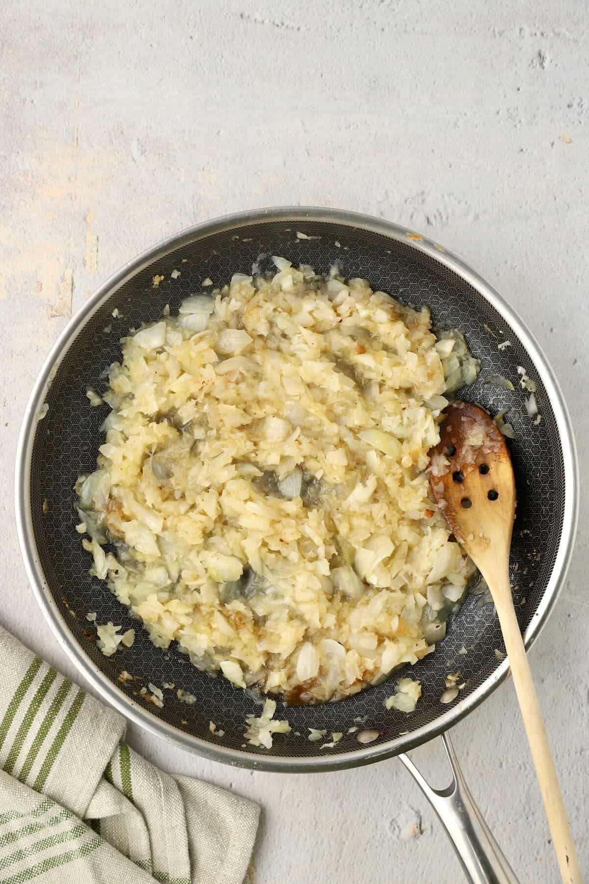 Caramelized onions, cooking in a skillet. About 20-30 minutes in.