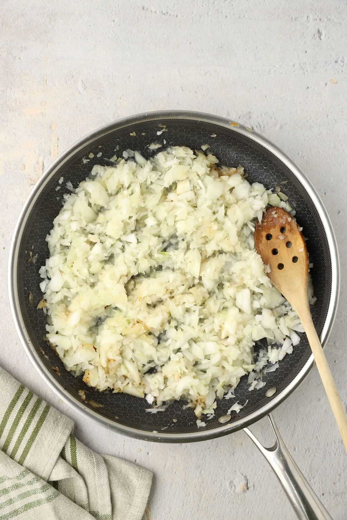 Caramelized onions, cooking in a skillet. About 10 minutes.