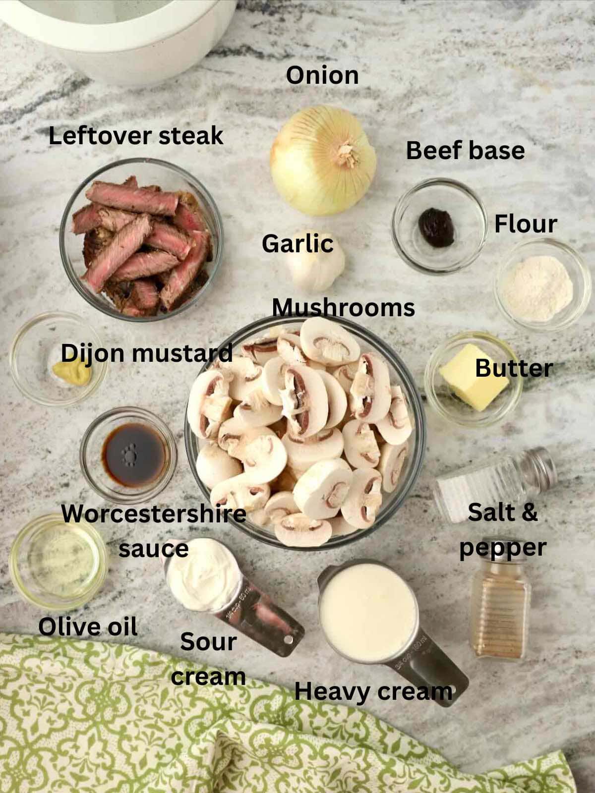 Ingredients to make beef stroganoff includes leftover steak, mushrooms, heavy cream, and flour.