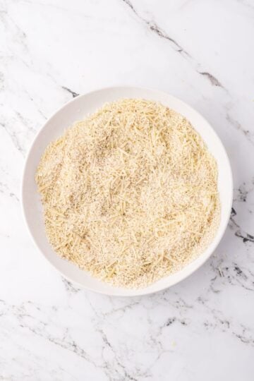 A bowl of panko, parmesan cheese, and seasonings.