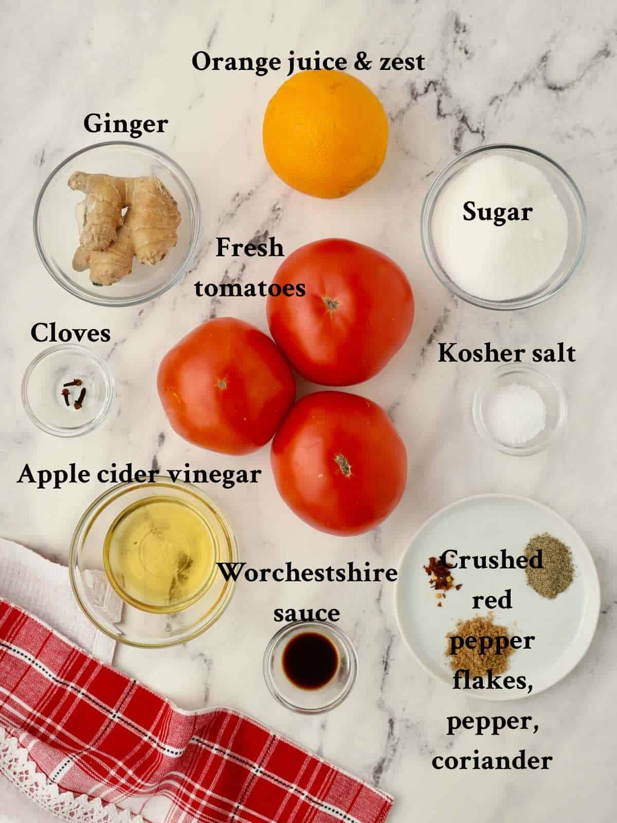 Ingredients for tomato jam include, tomatoes, sugar, apple cider vinegar, cloves, orange juice and zest, and seasonings.