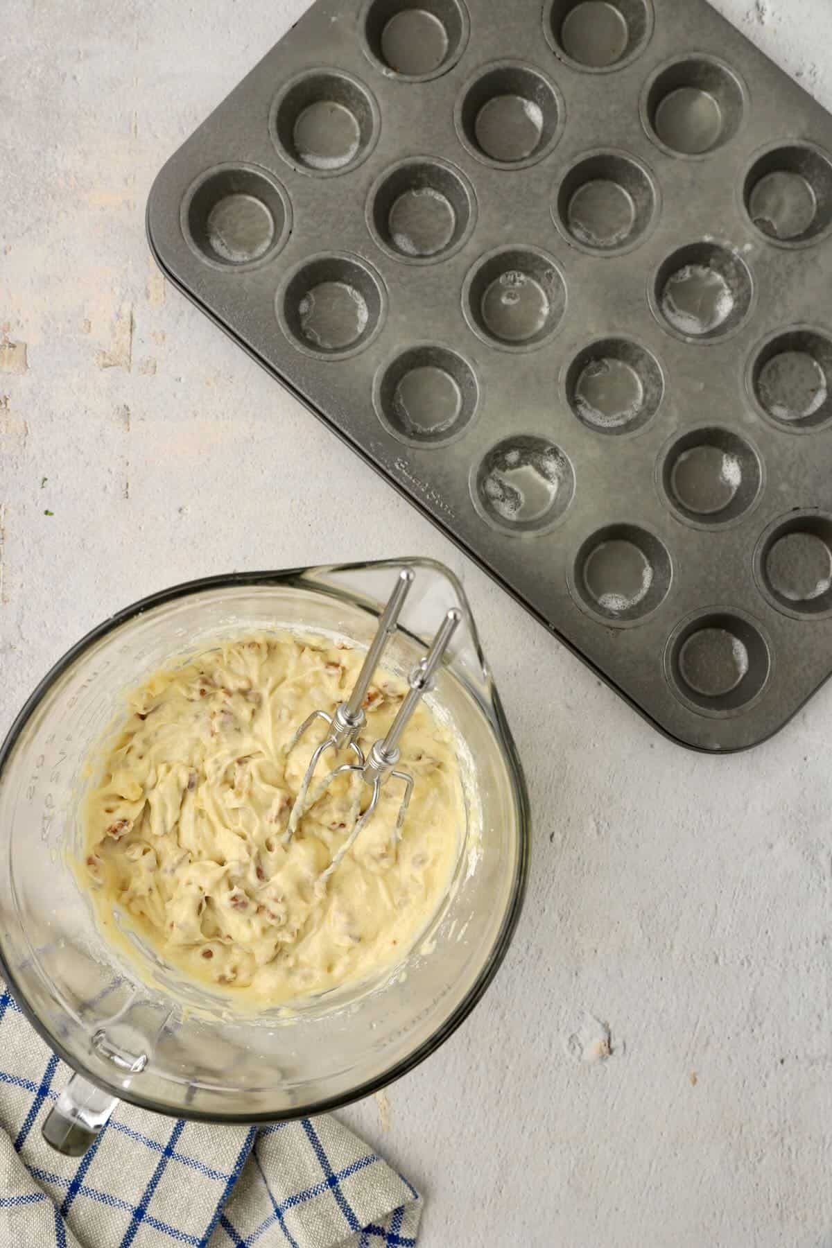Add flour and other dry ingredients to the muffin batter.