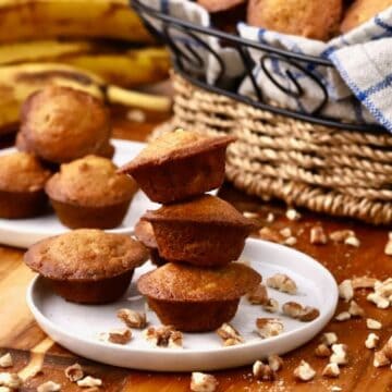Banana nut mini muffins stacked on a plates.
