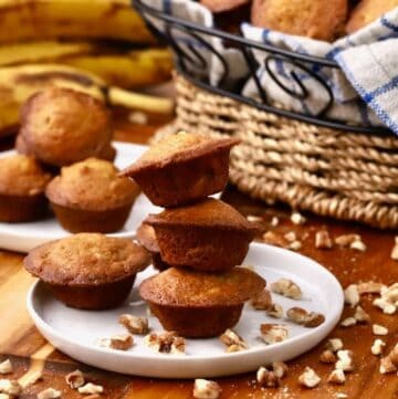 Banana nut mini muffins stacked on a plates.