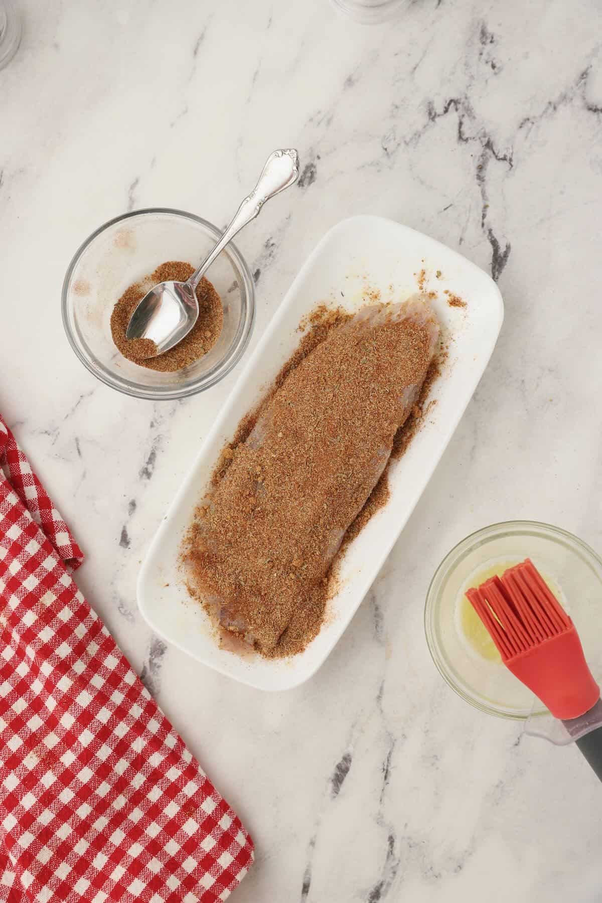 A redfish fillet coated with blackening seasoning.