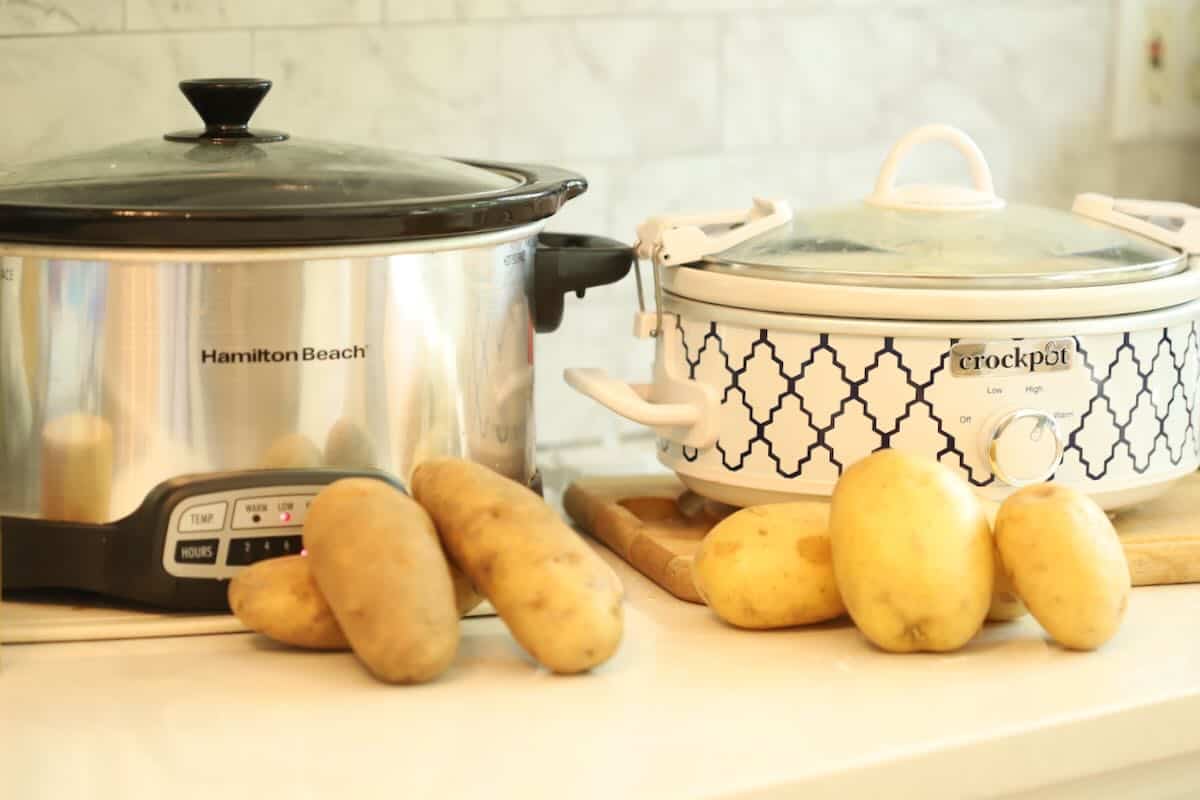 My smaller 2.5-quart pot, packed close to the brim with Yukon Golds, next to the larger 4-quart pot with the Yukon Golds and plenty of headspace