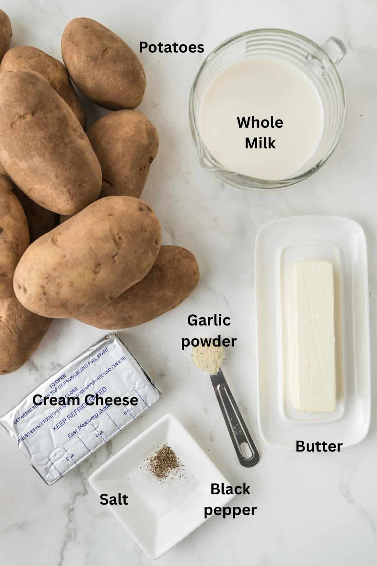 Ingredients for mashed potatoes made in a crock pot include russet potatoes, milk, butter, cream cheese, and seasonings.