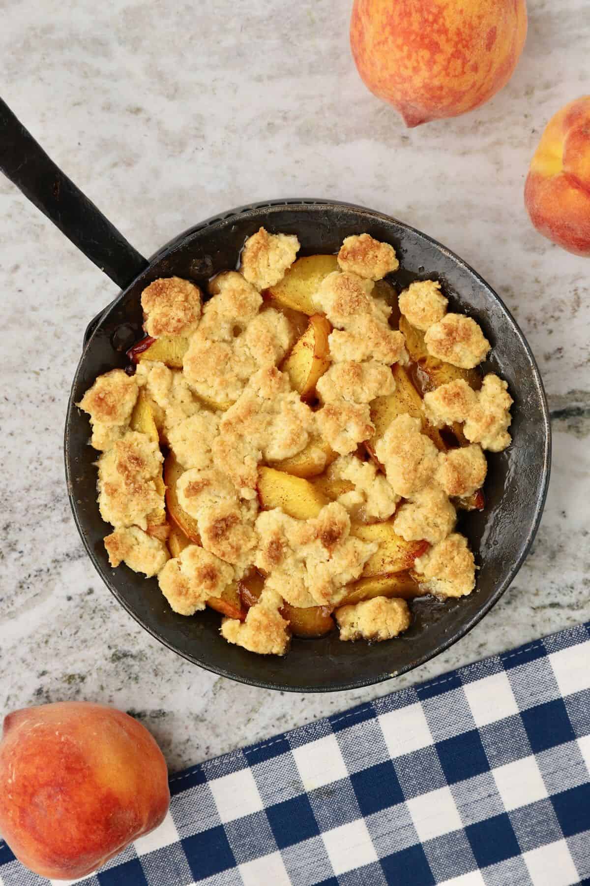 Small batch peach cobbler baked and cooling.