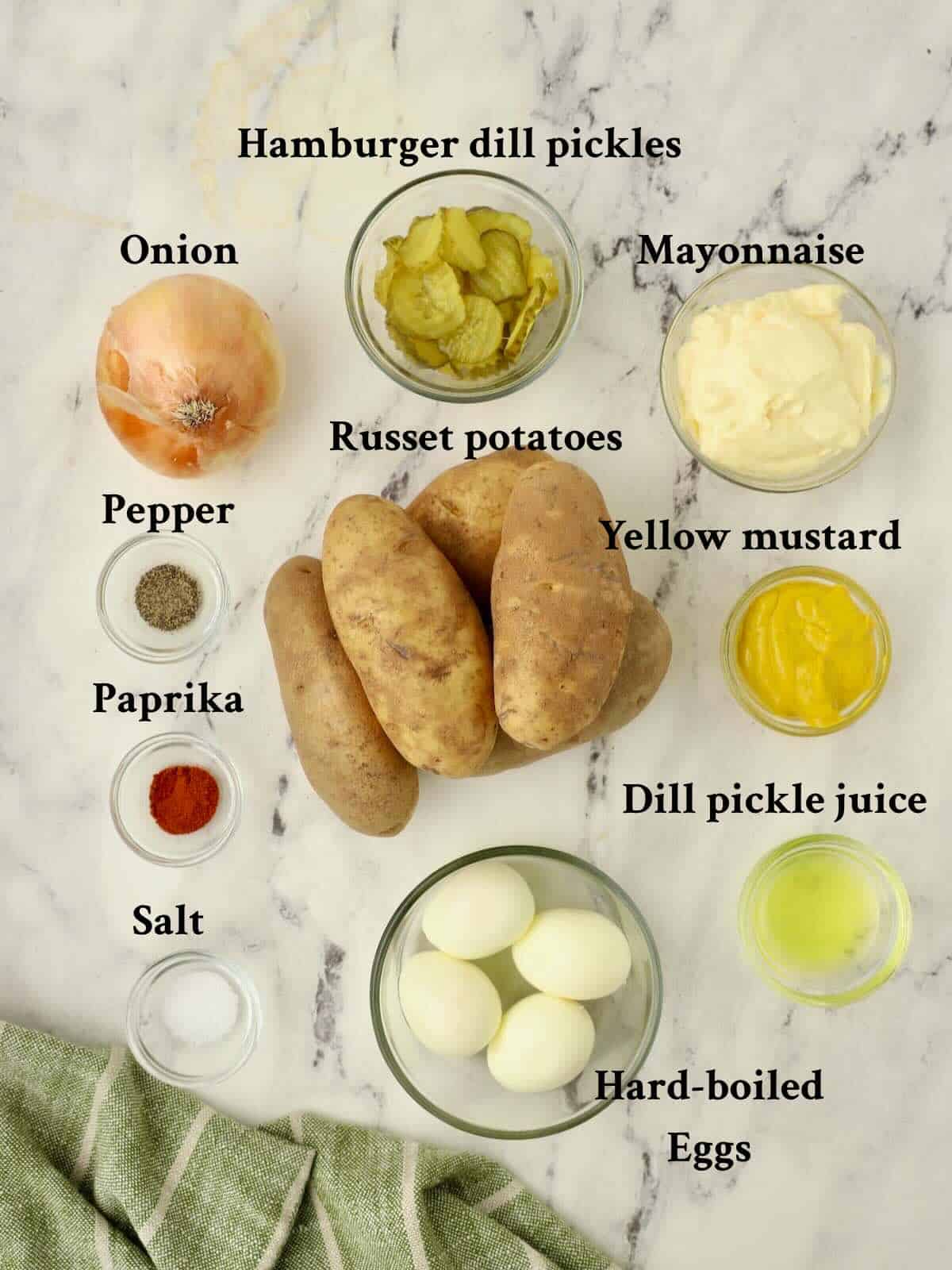 Ingredients to make Southern Potato Salad include russet potatoes, mayonnaise, mustard, dill pickles and hard boiled eggs.