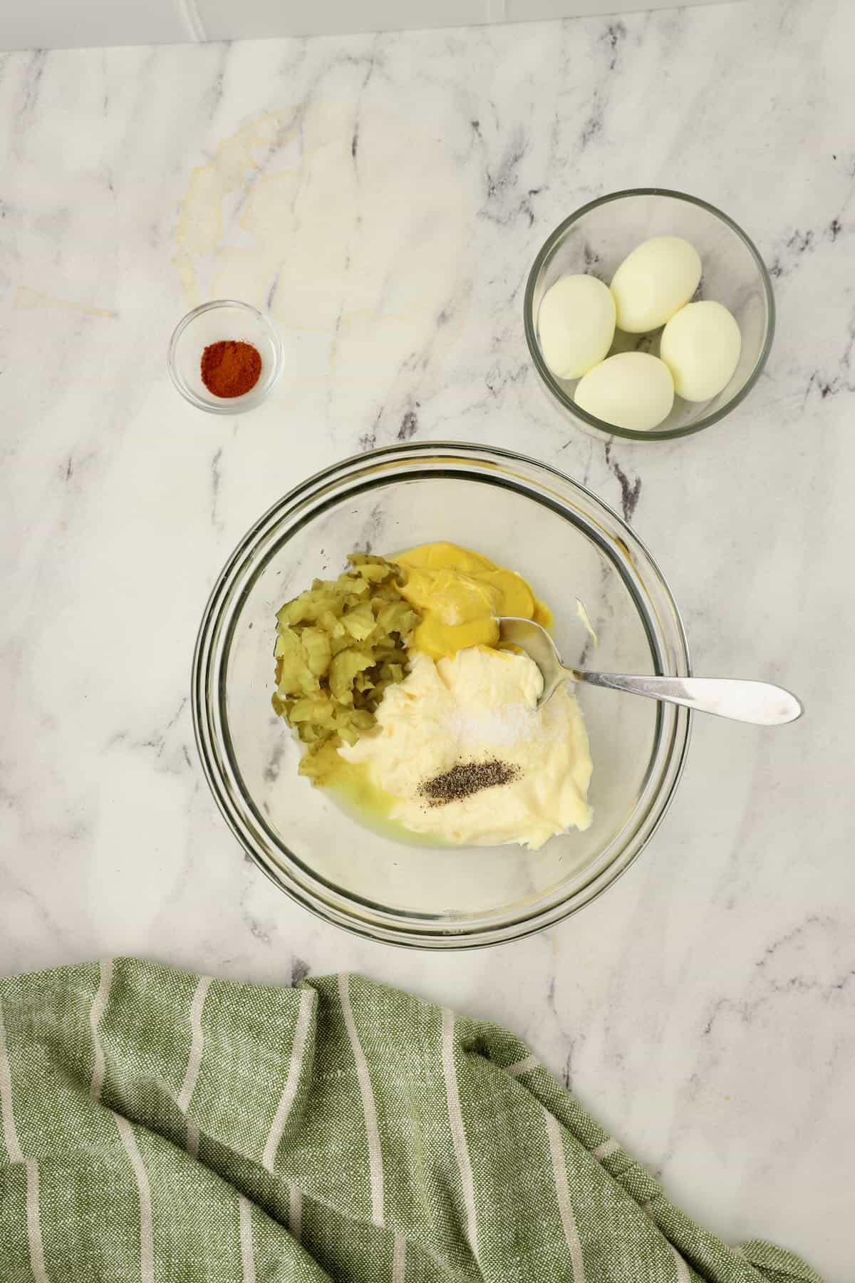 Make the potato salad dressing and combine mayo, mustard, and seasonings.