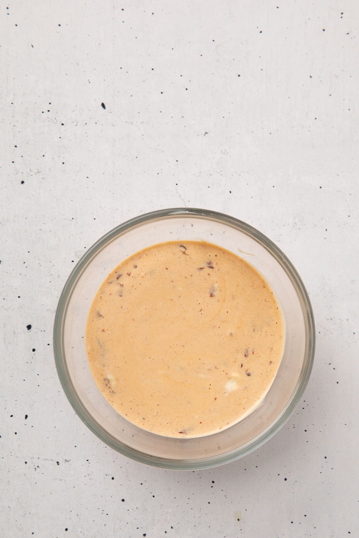 Chipotle and mayonnaise sauce in a glass bowl.
