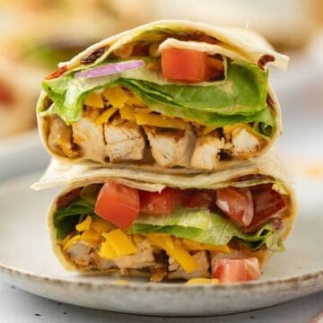 Grilled chicken wraps, cut in two, and stacked on top of each other.