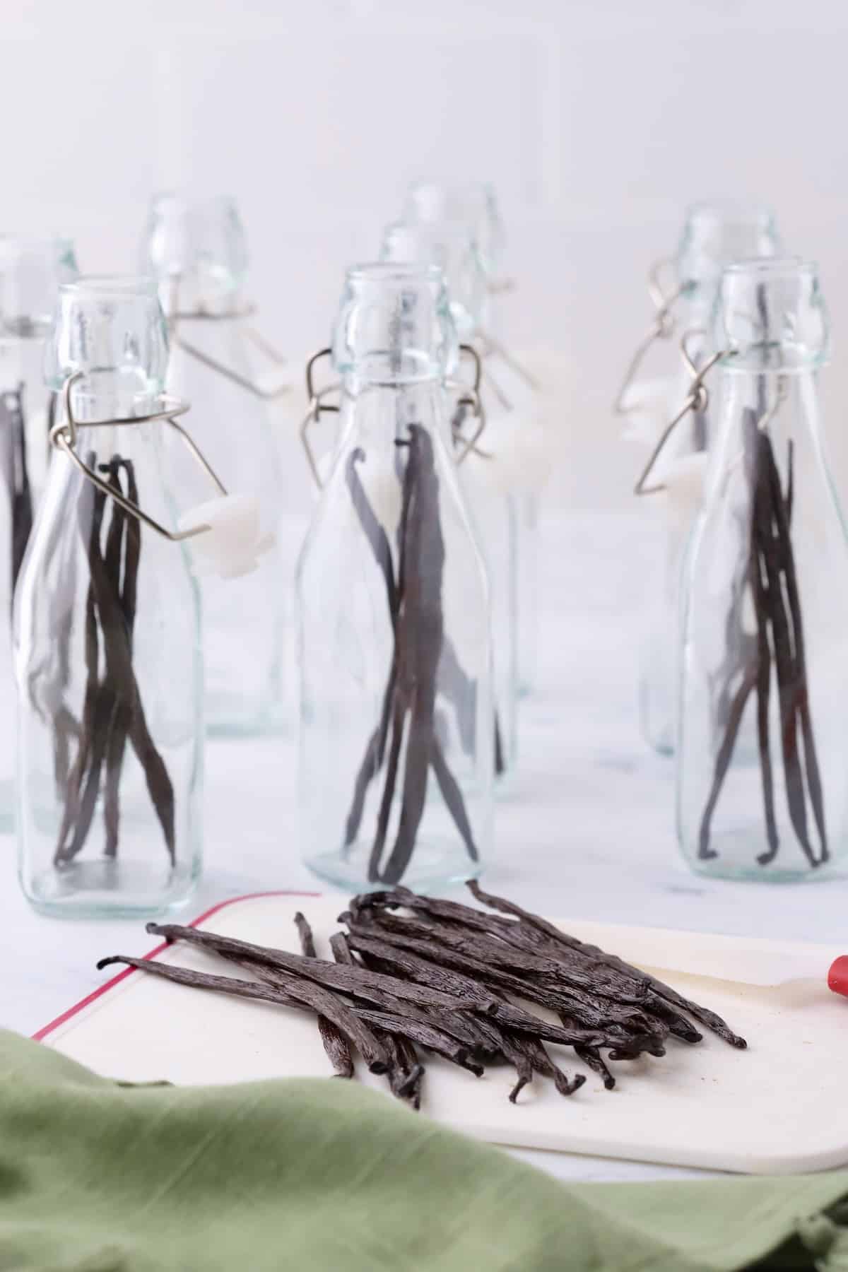 Glass jars with 4 vanilla beans in each jar.